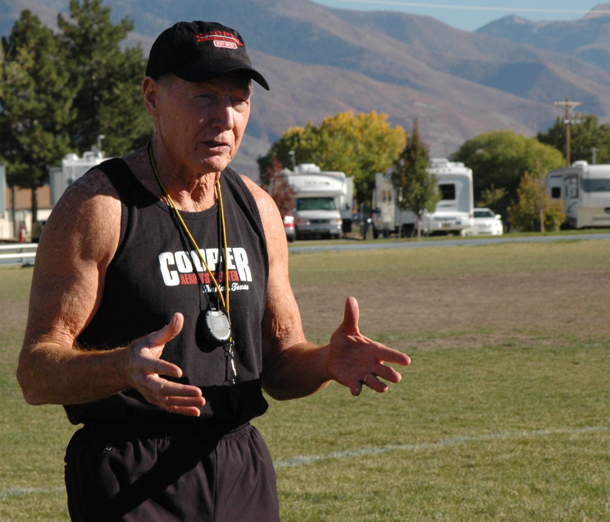 Roger Reynolds, director of contact relations at the Cooper institute, discusses proper form while running to a group of physical training leaders Oct. 24.