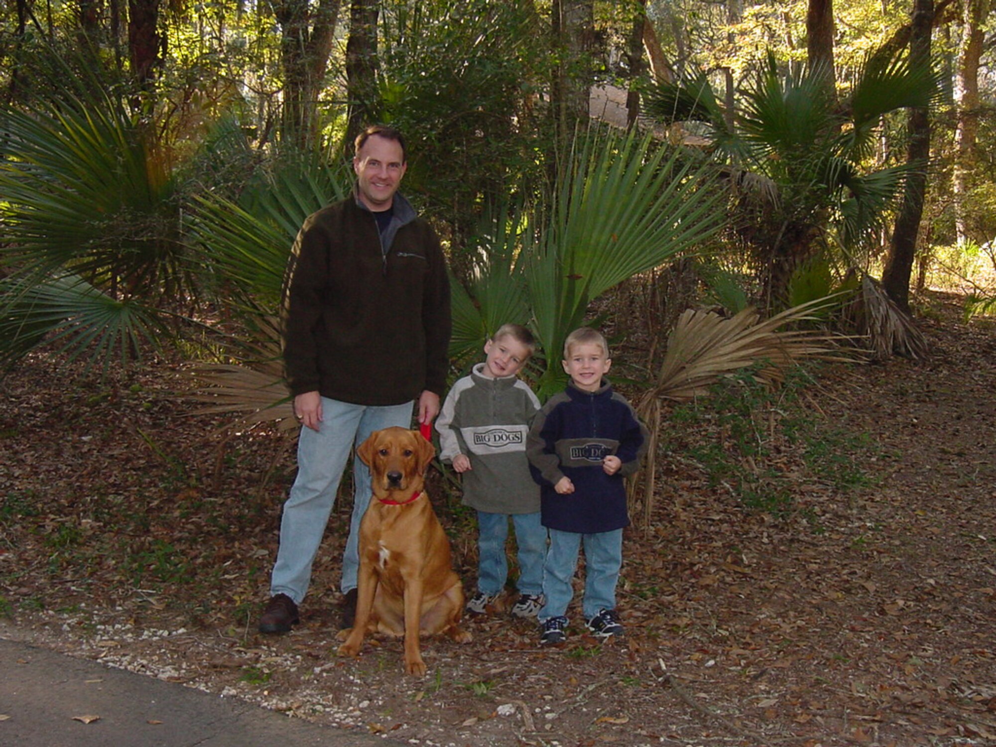 Maj. Kevin Heckle, 48th Force Support Squadron commander, his twin boys, Chris and Jon, and their dog Riley. (Courtesy photo)