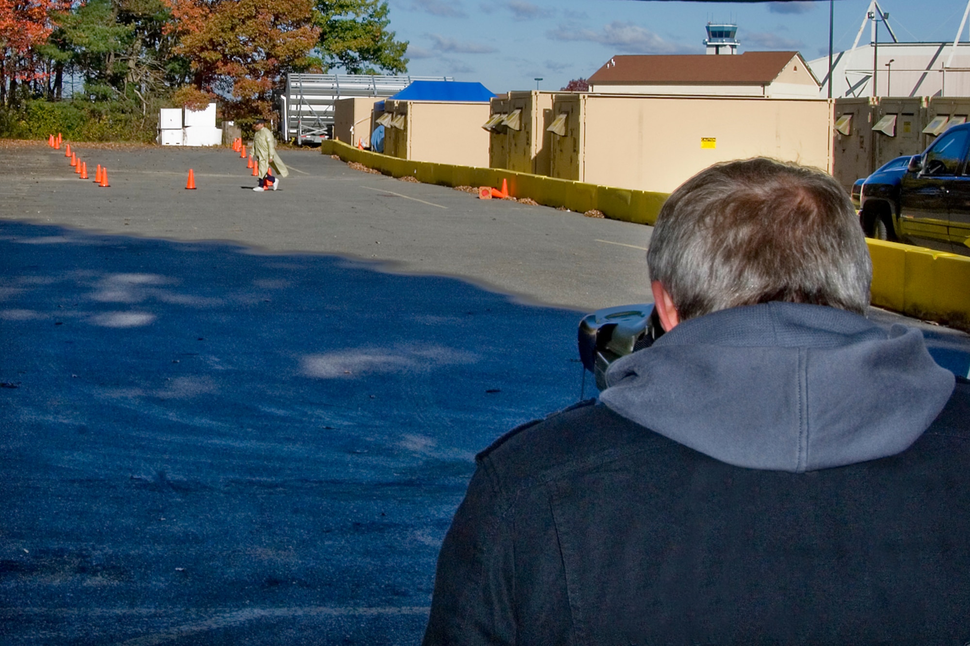 Mike Nolan, a business development manager for Vectronix Inc., uses infrared technology to look for simulated improvised explosive devices being carried by test subjects at Hanscom Air Force Base, Mass., Oct. 23.  The tests being conducted by the Air Force Counter-IED Office at Hanscom are expected to pinpoint technologies that can reduce suicide bombing threats in theater.