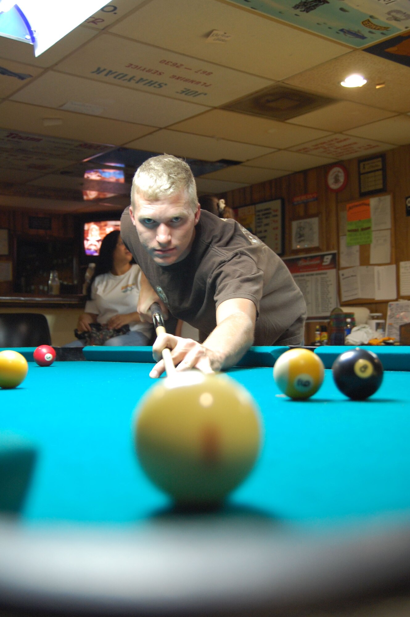 MOODY AIR FORCE BASE, Ga.-- Senior Airman Daniel Maloney, who is stationed at Moody Air Force Base, Ga., takes a shot while trying to break a world record. He and buddy Brian Lilley played more than 600 consecutive games of billiards in a 52 hour span. The record to break was 50 hours and two minutes. (Photo by Cassandra Locke/B & C Advertising)