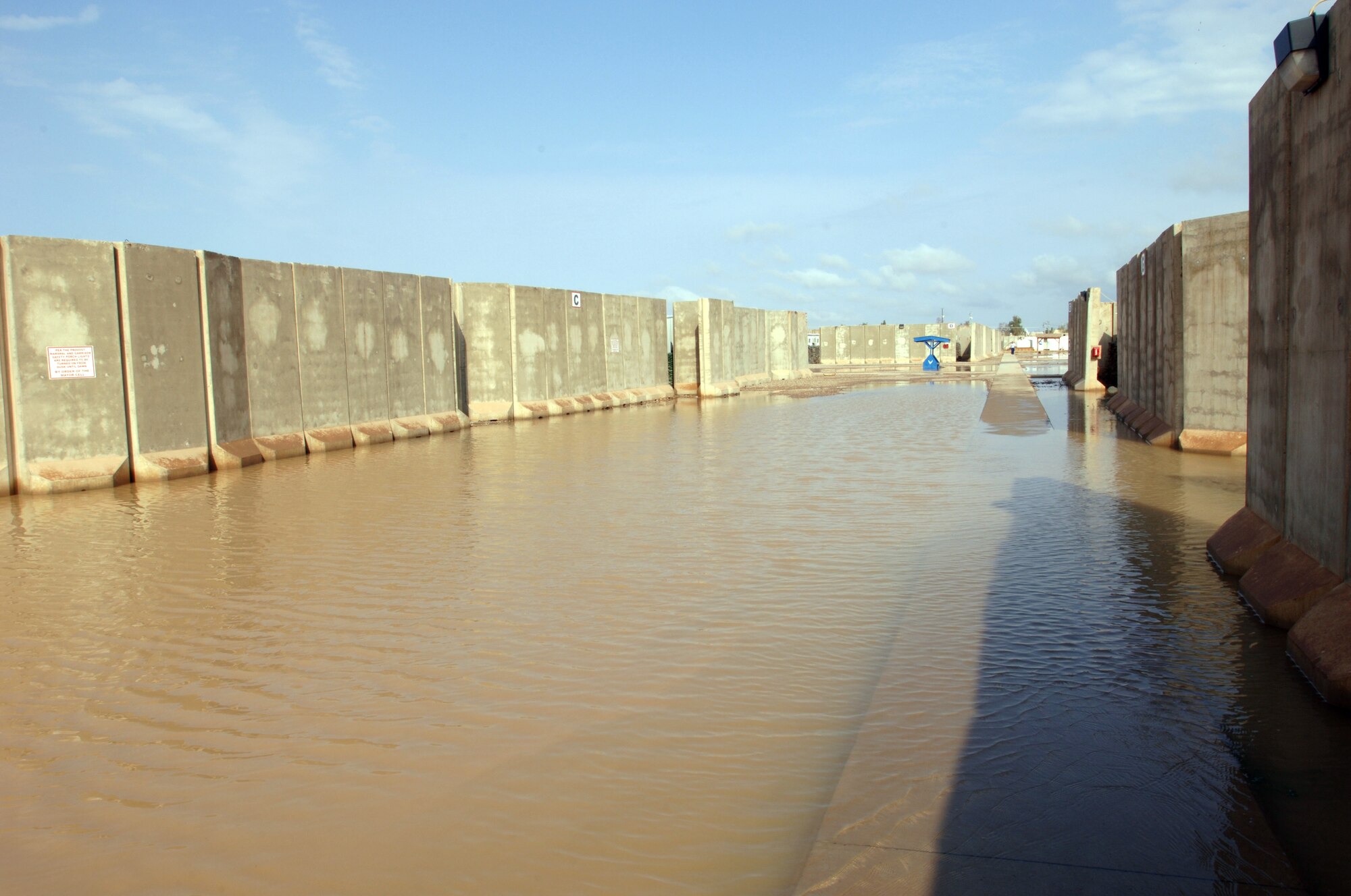 Water floods a housing area at Joint Base Balad, Iraq, Oct. 25. Because rain is infrequent in Iraq, when it does rain, the hardened ground soaks up little water. (U.S. Air Force photo/Tech. Sgt. Erik Gudmundson)