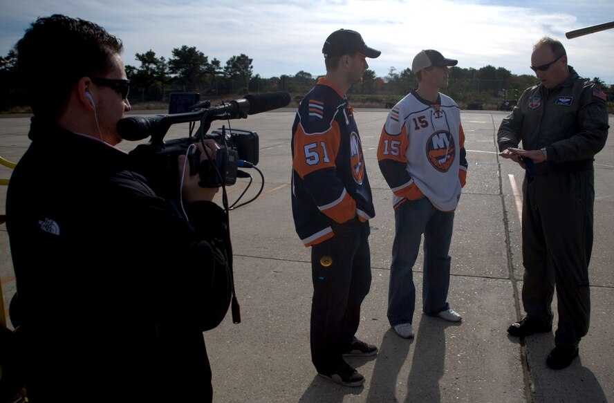 F.S. Gabreski Airport, Westhampton Beach, N.Y. ? 

Members of the New York Islanders hockey team made a visit to the 106th Rescue Wing on October 24, 2008. Jeff Tambellini, number 15, left wing, and Frans Nielsen, number 51, center, were the two members of the team who made it out to the 106th to learn about how the different functions of the base. During the tour they met with the crew of a HH-60, the HC-130 as well as meeting some of the Pararescue Jumpers. During their visit they greeted members of the base and signed autographs as well. 

(Official NYANG photo by Staff Sgt. David J. Murphy)