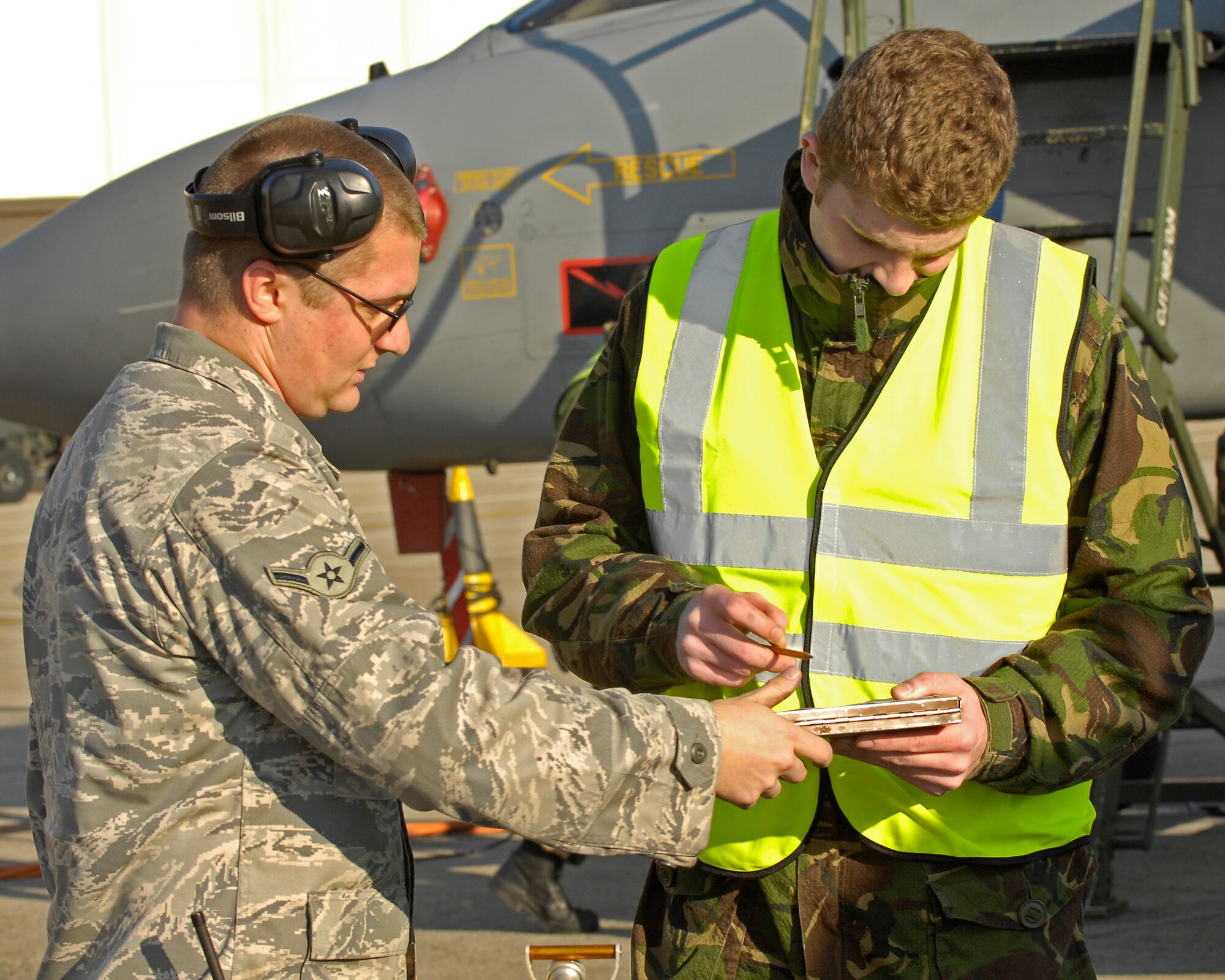 SPANGDAHLEM AIR BASE, Germany -- An American and British maintainer work together to prepare a Tornado GR4 Bomber Oct. 20, 2008.  The Royal Air Force sent members of the 9th Bomber Squadron, RAF Marham , to Spangdahlem to participate in a two-week exercise to provide integration between British air and land forces.  (Courtesy Photo)