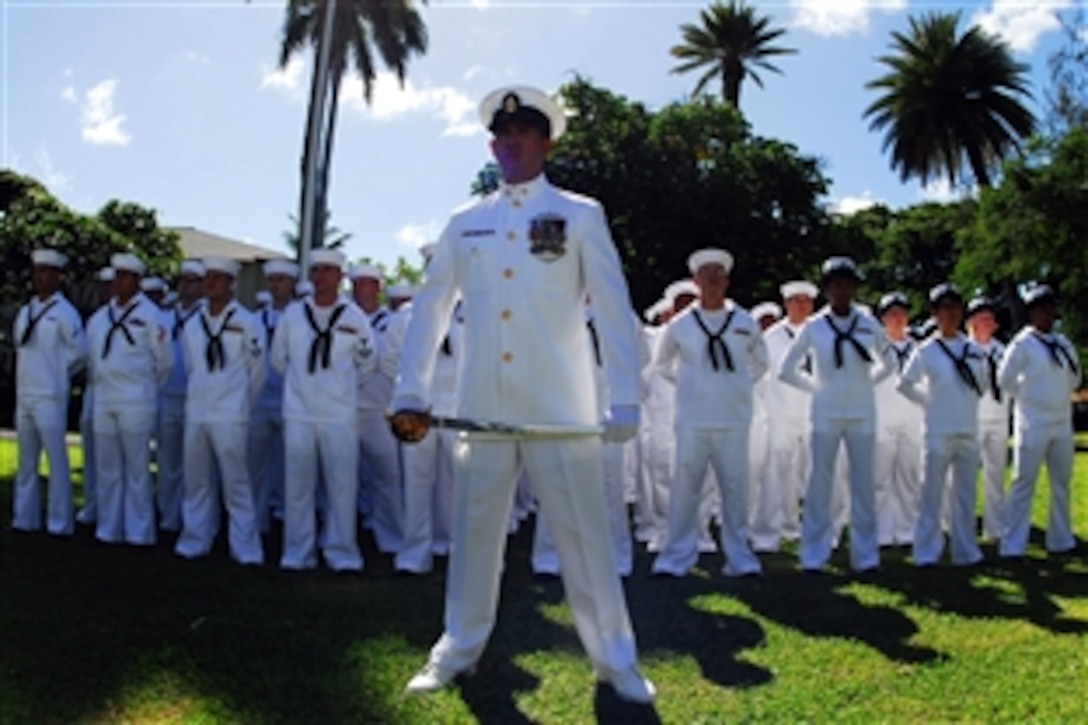 A U.S. Navy chief petty officer stands with sailors at parade rest during a change of command ceremony for the USS Port Royal at the USS Nevada Memorial on Naval Station Pearl Harbor, Oct. 23, 2008. 
