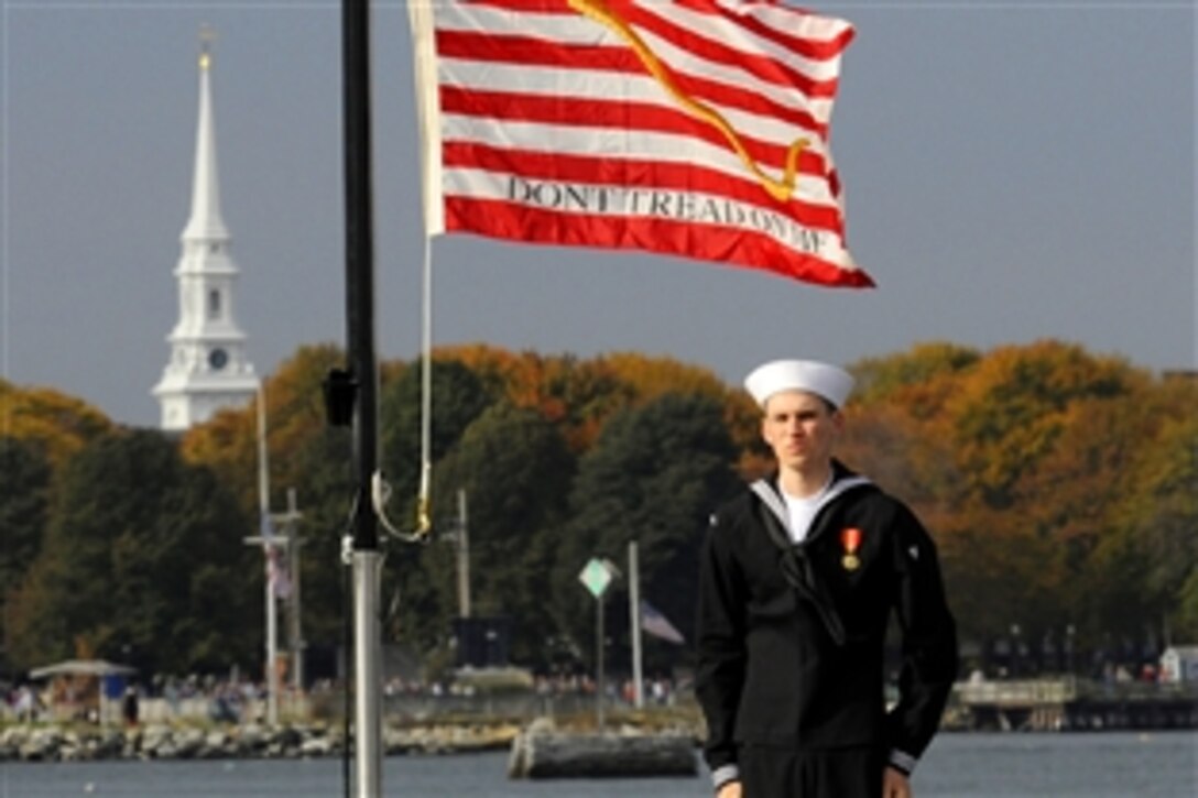U.S. Navy Recruit Randle Tiltson mans the Navy Jack during the commissioning ceremony for the USS New Hampshire at Portsmouth Naval Shipyard, Kittery, Maine, Oct. 25, 2008. 