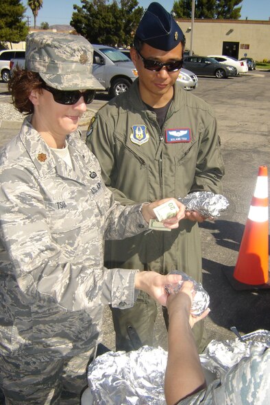 Maj. Tina Tsui, 452 AMW, and husband Maj. Roland Tsui, 452 OSS, preferred the single Bratwurst to the meal. (U.S. Air Force photo by Will Alexander)