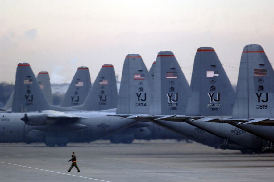 YOKOTA AIR BASE, Japan (AFPN) -- C-130 Hercules aircraft from the 36th Airlift Squadron sit on the flightline before a six-ship sortie. The squadron is the only forward-based tactical airlift squadron in the Pacific region. They provide C-130 aircrews to conduct theater airlift, special operations, aeromedical evacuation, search and rescue, repatriation and humanitarian relief missions. (U.S. Air Force photo by Master Sgt. Val Gempis)