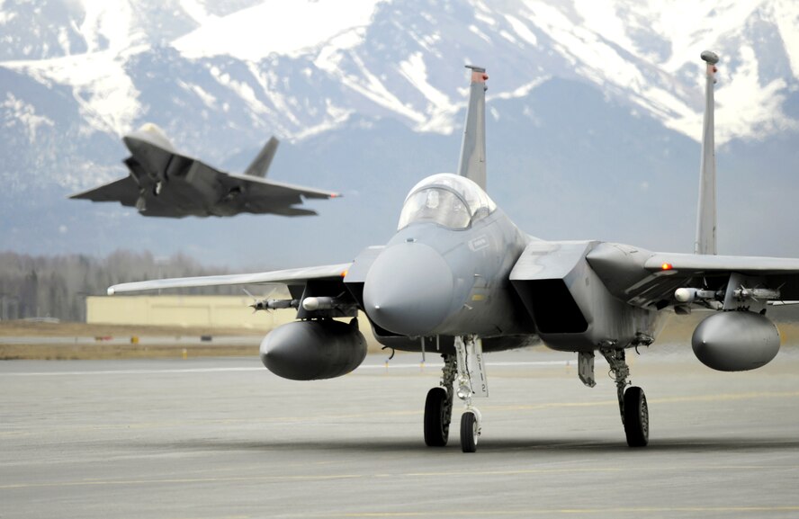 ELMENDORF AIR FORCE BASE, ALASKA -- An F-15 from Kadena Air Force Base, Japan taxis as an F-22 takes off for Northern Edge '08. The F-22 is assigned to the 90th Fighter Squadron here. 