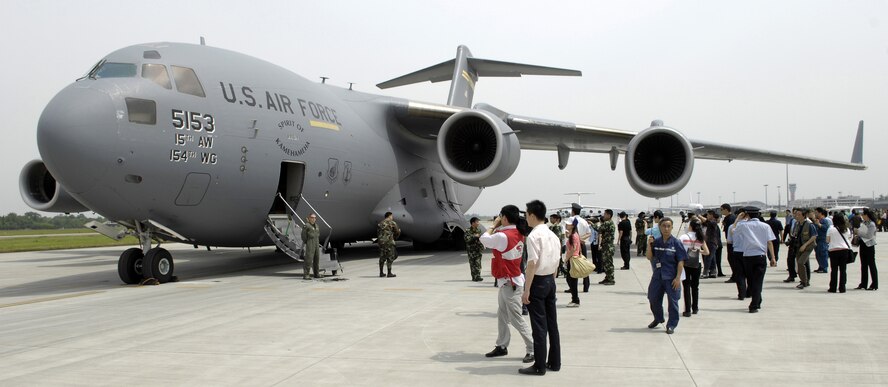 CHENGDU SHUANGLIU INTERNATIONAL AIRPORT, People's Republic of China (May 18, 2008) Members of the Chinese media gather around a C-17 Globemaster III from the 15th Airlift Wing at Hickam Air Force Base, Hawaii, at Chengdu Shuangliu International Airport. The United States Pacific Command support of earthquake relief efforts was authorized by Secretary of Defense Robert Gates, in support of the U.S. Department of State. (US Air Force photo / Tech. Sgt. Chris Vadnais)