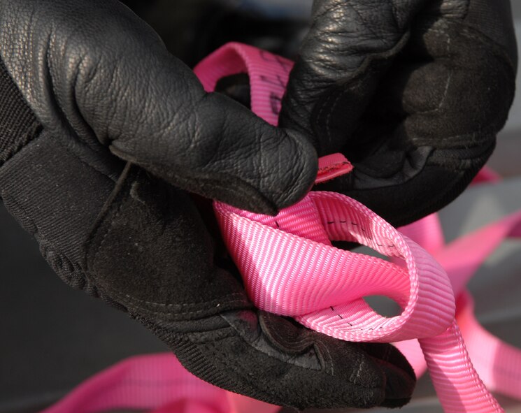 KUNSAN AIR BASE, Republic of Korea -- An 8th Civil Engineer Squadron fire fighter ties a knot on a rope during the ascending and descending rope rescue Technical One Training here, Oct 28. Air Force fire fighters and Korean national fire fighters train together on a regular bases on ascending and descending rope rescue training.(U.S. Air Force photo/Senior Airman Gustavo Gonzalez)