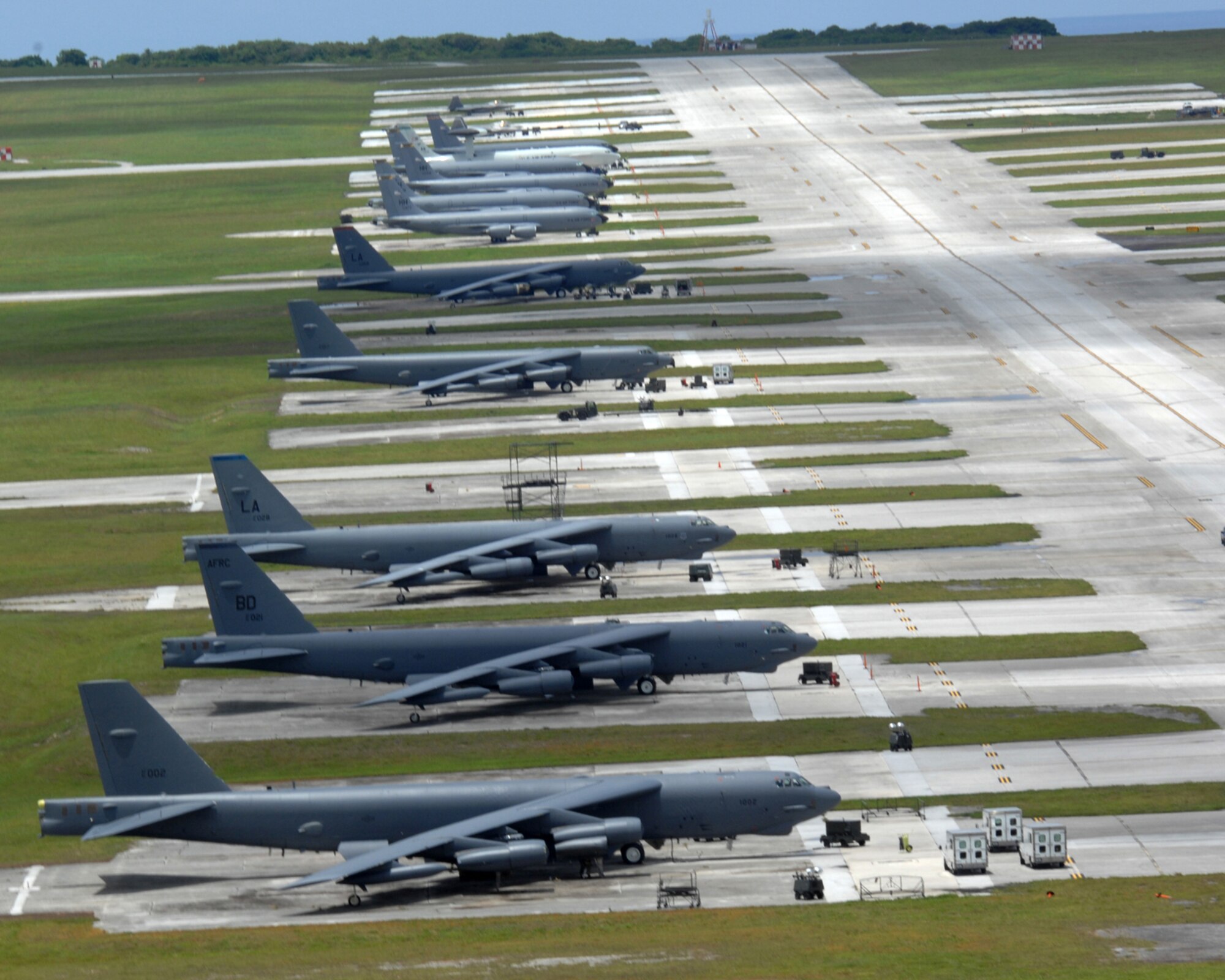 Air Force fighters, bombers, tankers and air control aircraft occupy the flightline at Andersen Air Force Base, Guam, Tuesday. The aircraft, deployed from several Air Force bases, are here to promote regional security and stability through three main focus areas: a continuous forward presence; a robust international exercise and training program; and significant joint military training exercises.  By maintaining a continuous forward presence and conducting joint exercises, the Pacific Air Force is able to foster improved relations and interoperability with its regional friends and allies. (U.S. Air Force photo)