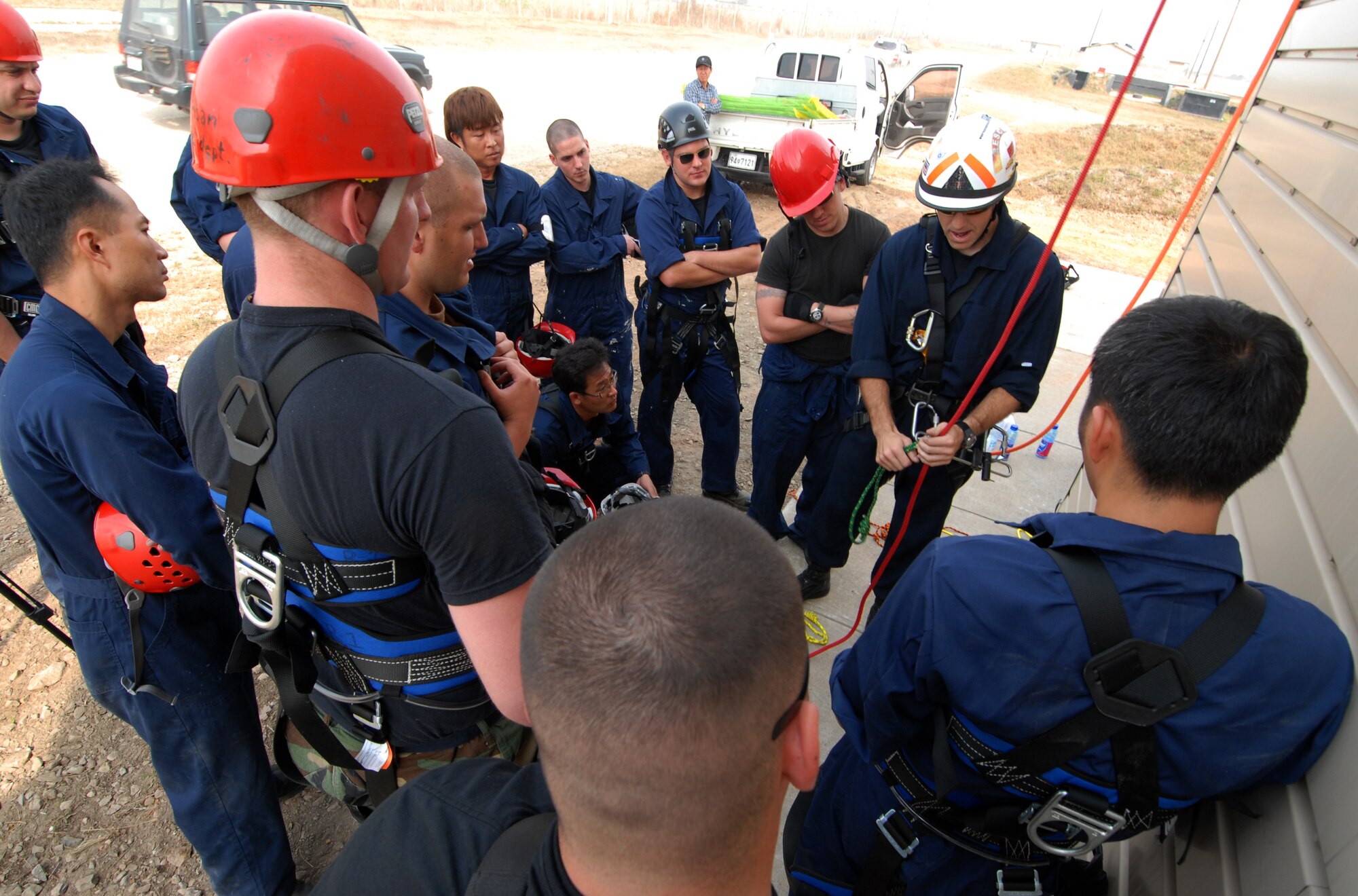 KUNSAN AIR BASE, Republic of Korea -- Staff Sgt. Christopher Waldrip, 8th Civil Engineer Squadron, instructs Air Force fire fighters and Korean national fire fighters on ascending and descending rope rescue during the Technical One Training here, Oct 21. (U.S. Air Force photo/Senior Airman Gustavo Gonzalez)