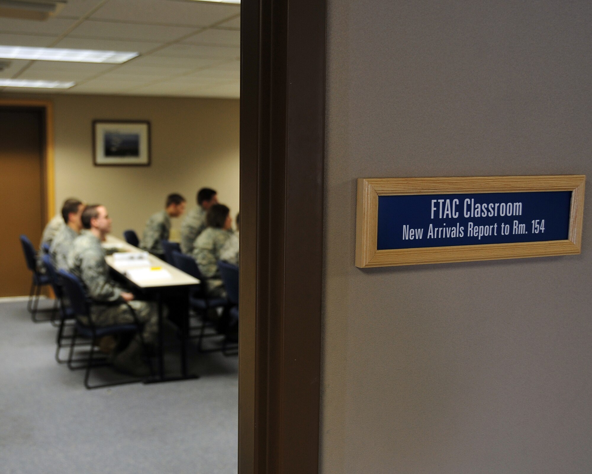 First term Airmen at the First Term Airmen Center attend a briefing Oct. 28, 2008, right before being released for lunch. FTAC is an important resource for first term Airmen because it shows them the ins-and-outs of the Air Force. (U.S. Air Force photo by Airman 1st Class Willard E. Grande II)