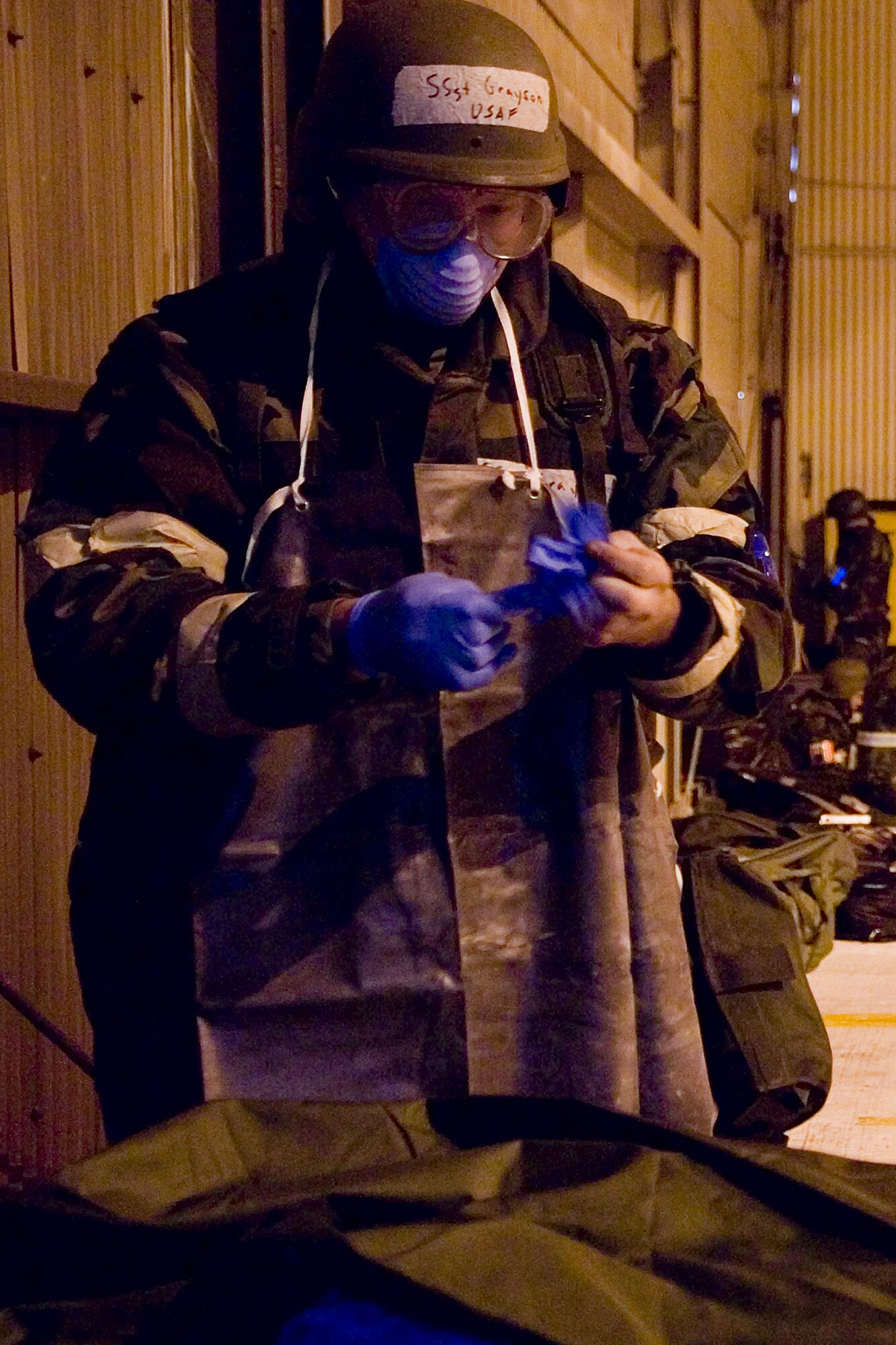 Staff Sgt. Noah Grayson, 62nd Force Support Squadron, prepares to process a simulated casualty Oct. 22. (U.S. Air Force photo/Abner Guzman)