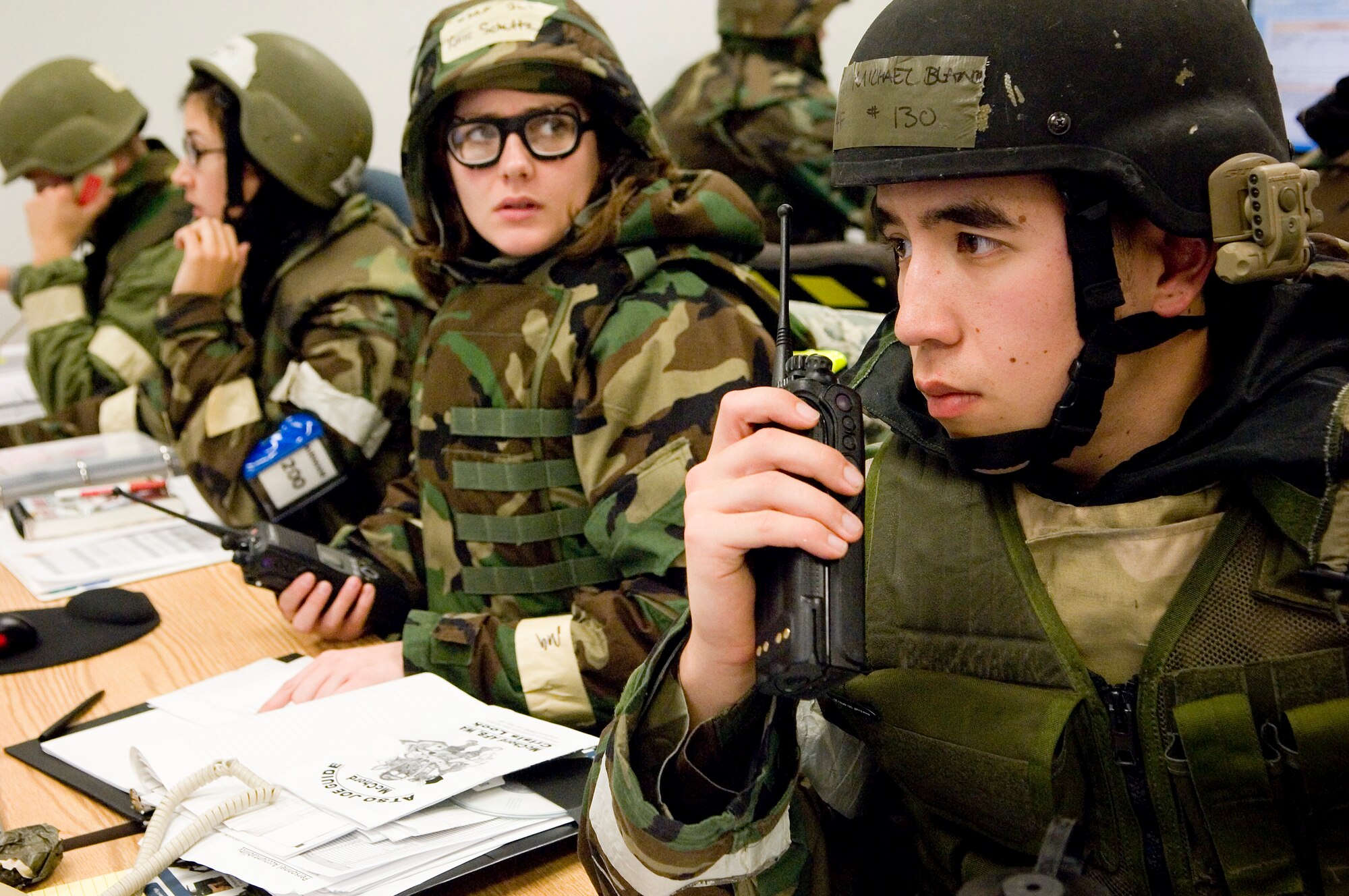 Staff Sgt. Michael Blanch, 62nd Civil Engineer Squadron, answers a call while working in the emergency operations center Oct. 21. (U.S. Air Force photo/Abner Guzman)