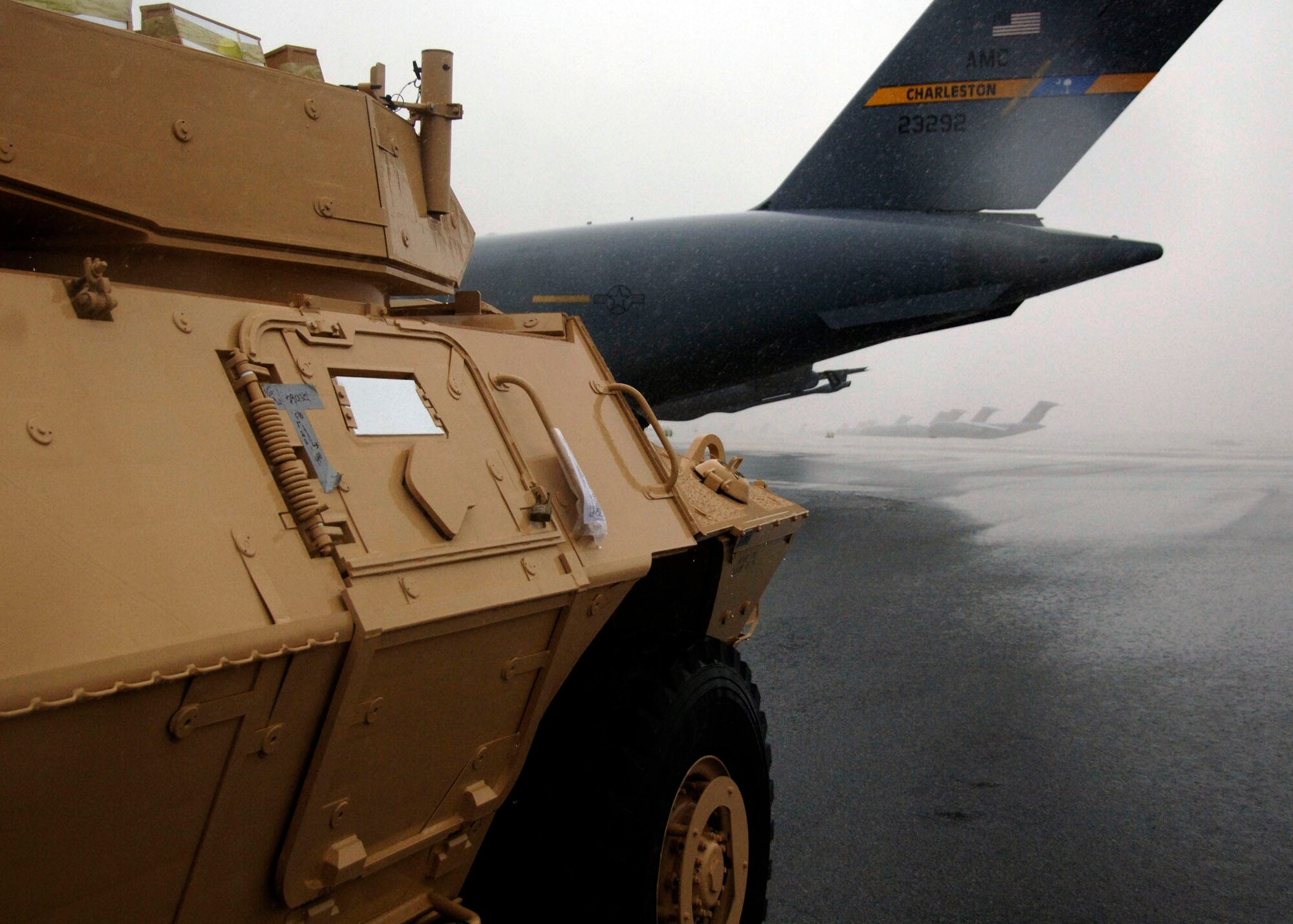 An Armored Security Vehicle awaits team Charleston members to marshal it into the back of a C-17 on the Charleston AFB flightline Oct. 24. Charleston AFB is airlifting 82 ASVs by C-17s and other Air Force aircraft to assist Soldiers in forward deployed locations. (U.S. Air Force photo/Airman 1st Class Timothy Taylor) 

