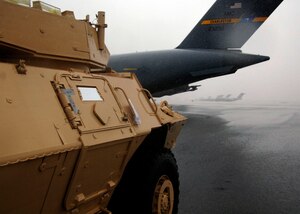 An Armored Security Vehicle awaits team Charleston members to marshal it into the back of a C-17 on the Charleston AFB flightline Oct. 24. Charleston AFB is airlifting 82 ASVs by C-17s and other Air Force aircraft to assist Soldiers in forward deployed locations. (U.S. Air Force photo/Airman 1st Class Timothy Taylor) 

