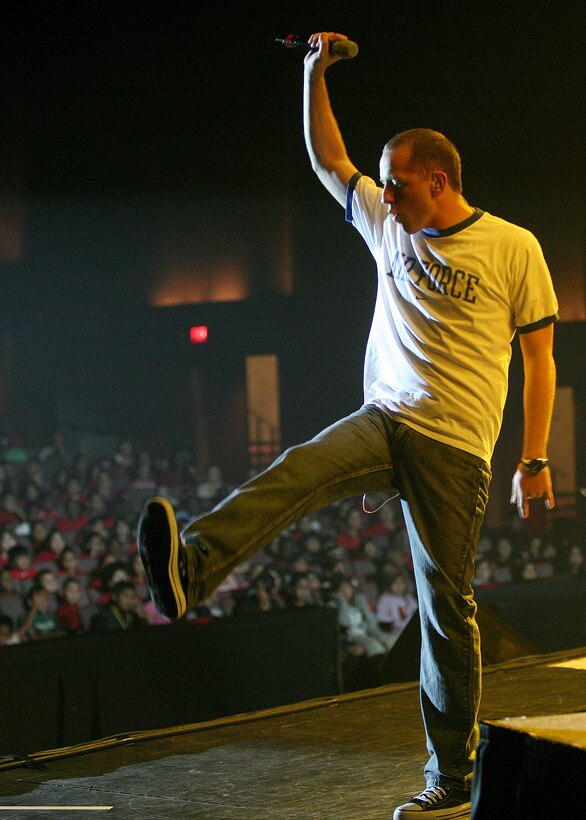Airman 1st Class Clayton Lee, a vocalist with Top Flight puts the finishing touches on a musical number while performing for 2,500 middle school children Oct. 22 at the Lila Cockrell Theater in San Antonio. Top Flight performed four shows in support of Red Ribbon Week, a national observance to raise awareness in youth to make the right decisions about substance abuse and inform them on the dangers of drugs. Top Flight is the popular music ensemble of the Air Force Band of the West from nearby Lackland Air Force Base. (U.S. Air Force photo/Robbin Cresswell)
