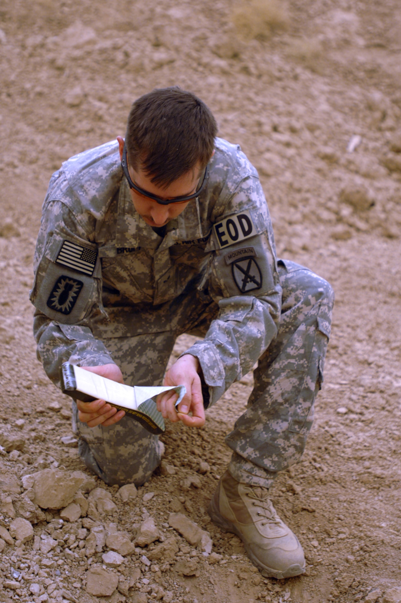 KIRKUK REGIONAL AIR BASE, Iraq – Senior Airman Joshua Brum, 506th Air Expeditionary Group Explosive Ordnance Disposal flight journeyman, prepares to dispose of insurgent ordnance Sept 15. Airman Brum is one of six EOD Airmen forward deployed to FOB McHenry where they are embedded with soldiers of the Army’s 10th Mountain Division. He is deployed from Nellis Air Force Base, Nev., and calls Las Vegas, Nev., home. (U.S. Air Force photo/Tech. Sgt. Jeff Walston)