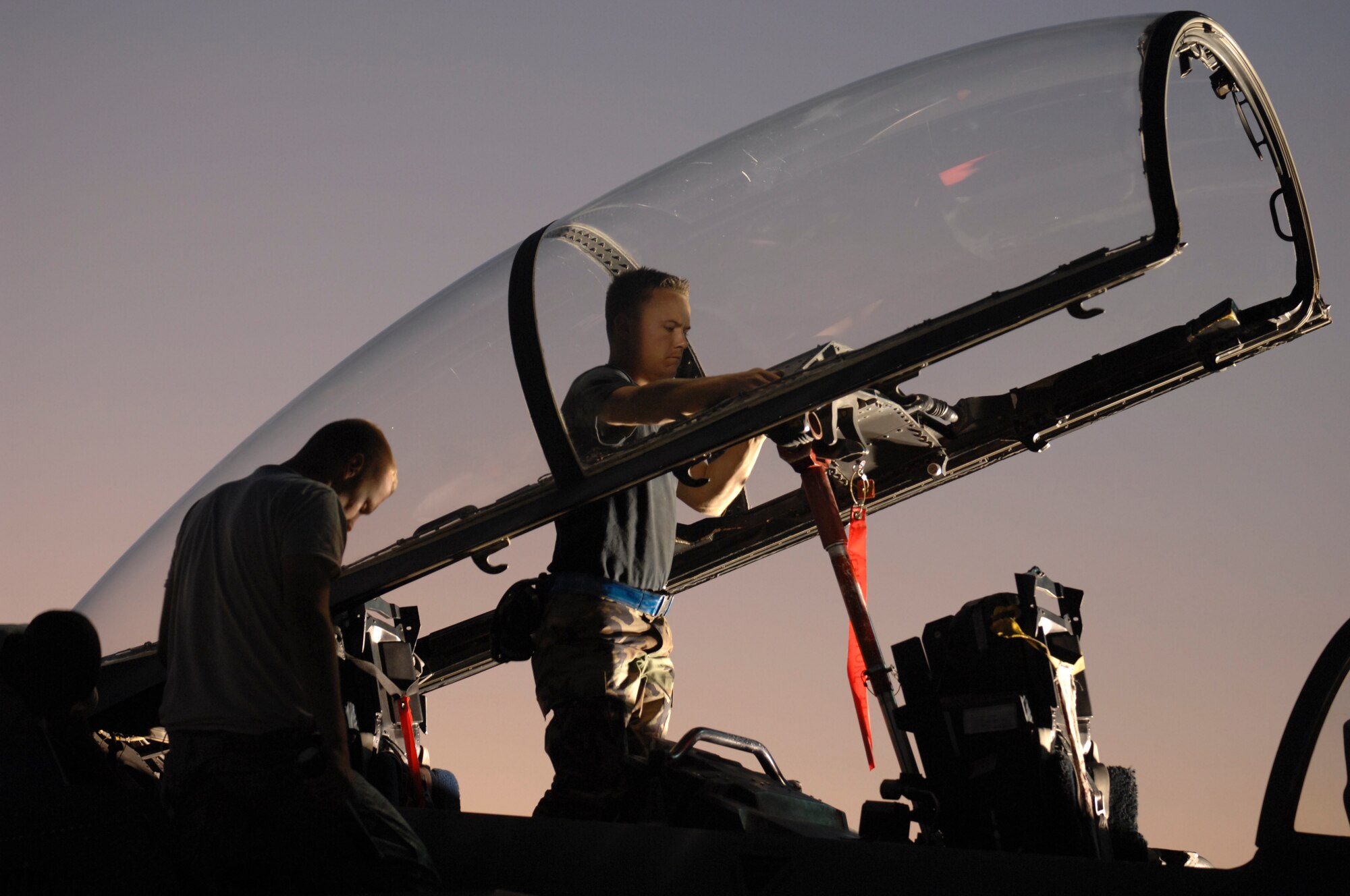Staff Sgt. Michael Holley, an F-15E crew chief assigned to the 4th Aircraft Maintenance Squadron, Seymour Johnson Air Force Base, N.C., inspects the cockpit after a two hour sortie during Red Flag 09-1 Nellis AFB, Nev., Oct. 24, 2008. Red Flag is a multi-national exercise providing a realistic environment to practice combat scenarios. The experience gained during the exercise is vital to the survival of pilots in combat.
(U.S. Air Force Photo/Senior Airman Larry E. Reid Jr., Released)