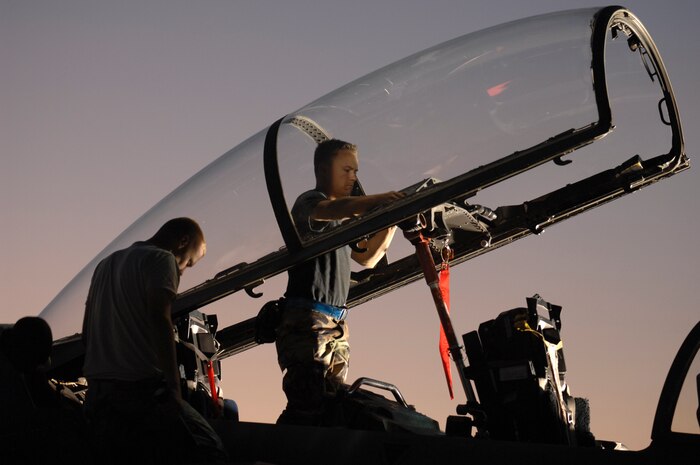 Staff Sgt. Michael Holley, an F-15E crew chief assigned to the 4th Aircraft Maintenance Squadron, Seymour Johnson Air Force Base, N.C., inspects the cockpit after a two hour sortie during Red Flag 09-1 Nellis AFB, Nev., Oct. 24, 2008. Red Flag is a multi-national exercise providing a realistic environment to practice combat scenarios. The experience gained during the exercise is vital to the survival of pilots in combat.(U.S. Air Force Photo/Senior Airman Larry E. Reid Jr., Released)