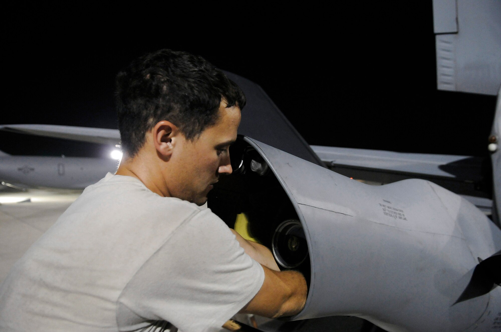 Staff Sgt. Ryan Letourneau changes out the boom light on a KC-135 Stratotanker Oct. 27 at an air base in Southwest Asia. The KC-135 provides aerial refueling support to Air Force Navy, Marine Corps and allied nation aircraft operating in the Central Command area of responsibility. Sergeant Letourneau is assigned to the 379th Expeditionary Aircraft Maintenance Squadron. He is a native of Prosser, Wash., and is deployed from Fairchild Air Force Base, Wash. (U.S. Air Force photo/Tech. Sgt. Michael Boquette) 