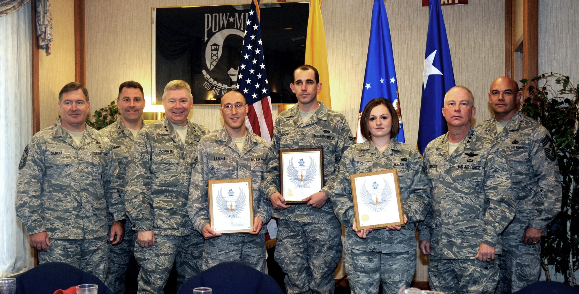CANNON AIR FORCE BASE N.M. -- Chief Master Sgt. Michael Gilbert, Air Force Special Operations Command command chief, Col. Timothy Leahy, 27th Special Operations Wing commander, Maj. Gen. Kurt Cichowski, Air Force Special Operations Command vice commander, Staff Sgt. Scott Labonte, 27th Special Operations Maintenance Operations Squadron, Airman First Class Kevin Burger, 27th Special Operations Civil Engineer Squadron, Senior Airman Kim Tifre, 27th Special Operations Services Squadron, Lt. Gen. Donald Wurster, Air Force Special Operations Command commander and Chief Master Sgt. Daniel Fischer, 27th Special Operations Command chief stand at the Pecos Trail Dining Facility Oct. 24. The Diamond Sharp awards breakfast recognizes Airmen who set the example for others to follow. (U.S. Air Force photo by Elizabeth Merchant)  
  