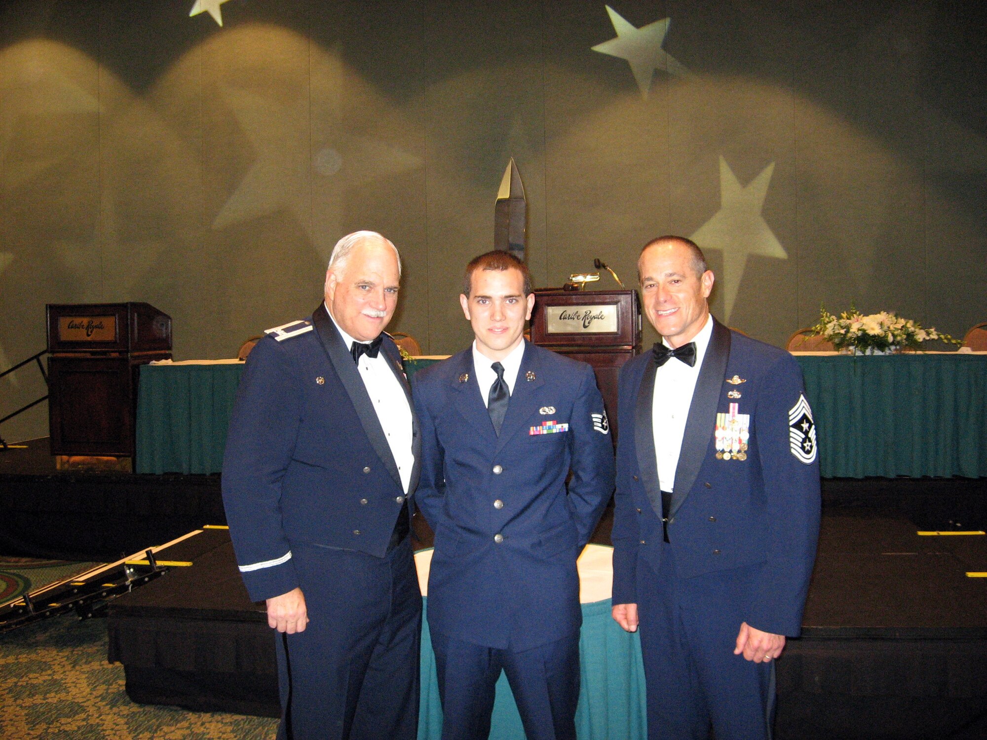 Colonel Mike Mungavin, Recipient of the 15th Order of the Sword, Staff Sergeant Ryan Mungavin, and Command Chief Master Sergeant Ben Futrell, all of the 315th Airlift Wing pose for a photo on October 24, 2008 in Orlando, Fla. at the Order of the Sword induction ceremony held there.  The Order of the Sword is the highest enlisted honor in the Air Force Reserve.  (U.S. Air Force courtesy photo)

