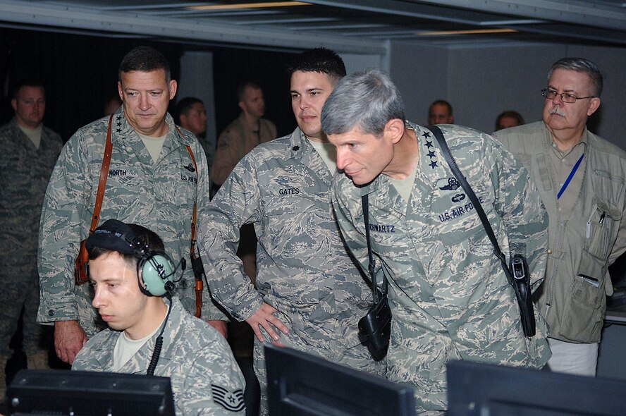 Air Force Chief of Staff Gen. Norton Schwartz and U.S. Air Forces Central Commander Lt. Gen. Gary North observe an Airman at work in the 727th Expeditionary Air Control Squadron. Also present are Lt. Col. Bryan Gates, 727th EACS commander, and foreign policy adviser Donald Bishop. The 727th EACS, also known as "Kingpin," provides airspace deconfliction, air refueling positioning and management, and close-air support and dynamic targeting support for aircraft flying through Iraq's 270,000 square miles of airspace. (U.S. Air Force photo/Tech. Sgt. Richard Lisum)