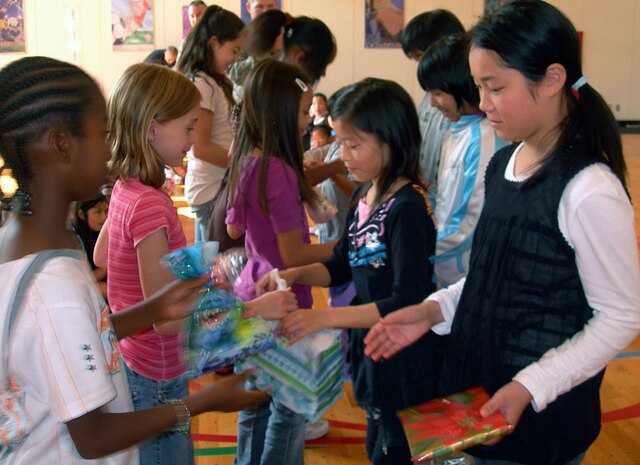 MISAWA AIR BASE, Japan -- Elementary students from Oirase Town and Misawa Air Base exchange presents during the 16th Annual Cultural Exchange Oct. 18, 2008. (Courtesy photo by Simon Bernard )