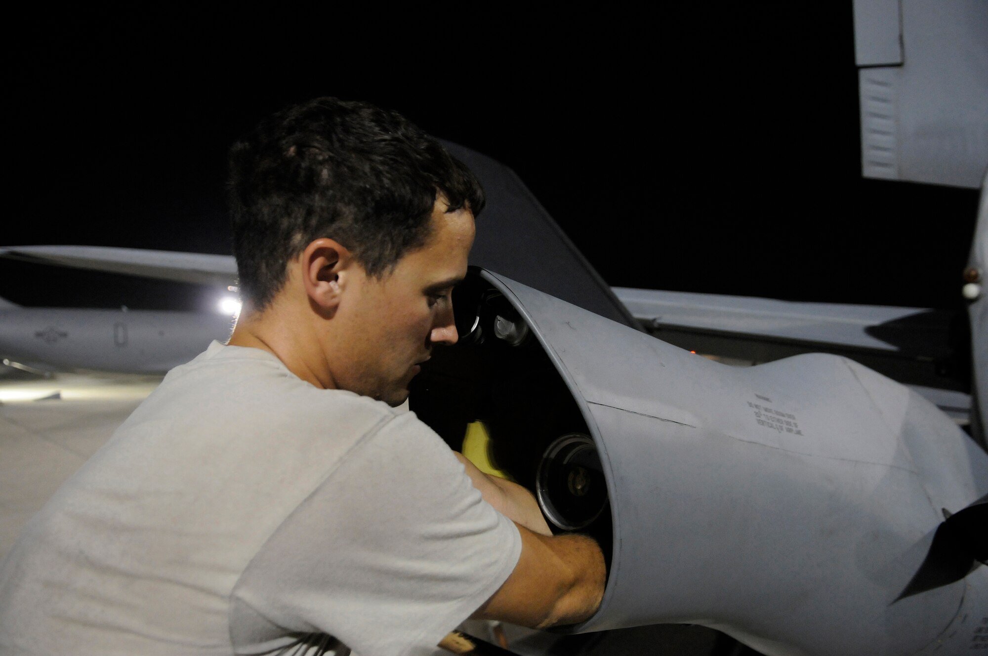 Staff Sgt. Ryan Letourneau, 379th Expeditionary Aircraft Maintenance Squadron, 340th Aircraft Maintenance Unit, changes out the boom light on a KC-135 Stratotanker, October 27, at an undisclosed air base in Southwest Asia.  The KC-135 provides the core aerial refueling capability for the United States Air Force and also provides aerial refueling support to Navy, Marine Corps and allied nation aircraft operating in the Central Command area of responsibility. Sergeant Letourneau is a native of Prosser, Wash., and is deployed from Fairchild Air Force Base, Wash., in support of Operations Iraqi and Enduring Freedom and Joint Task Force-Horn of Africa.  (U.S. Air Force photo by Tech. Sgt. Michael Boquette/Released)