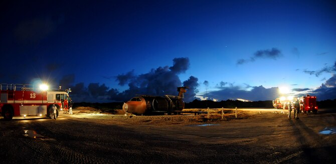 ANDERSEN AIR FORCE BASE, Guam – Airmen from the 36th Civil Engineer Squadron Fire and Emergency Services Flight prepare their equipment before training with the aircraft fire simulator here Oct. 27. Sixty-two Airmen participated in the training.  (U.S. Air Force photo by Airman 1st Class Courtney Witt)