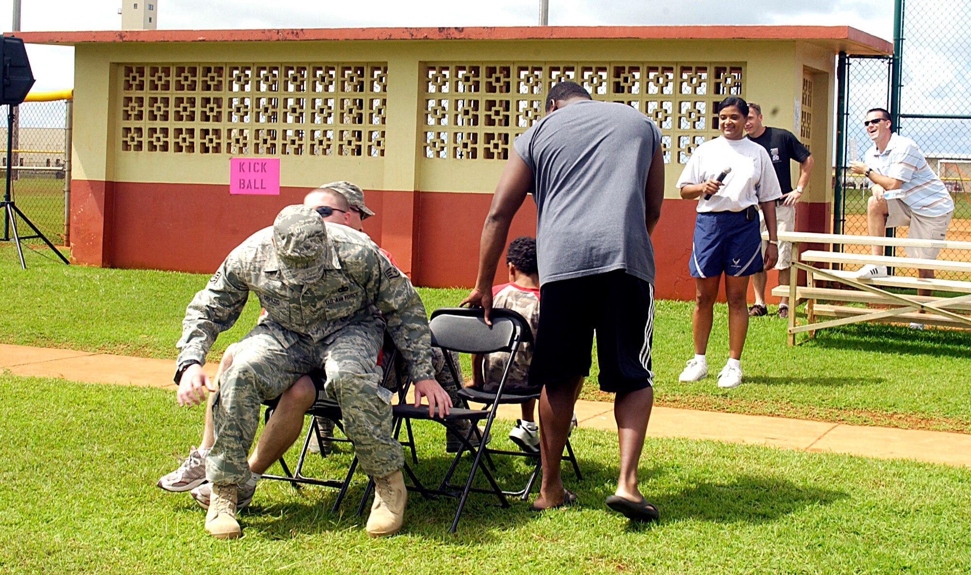 Junior Enlisted Appreciation day activites were held at the sports complex near the paintball field Oct. 24 here. (Counter-clockwise from bottom left) Participants Staff Sgt. Corey Defazio, 736th Security Forces Squadron, Staff Sgt. Carlos Borders, 736th SFS, Jerimiah Augustine, son of Tech. Sgt. Anthony Augustine, 644th Combat Communications Squadron, Staff Sgt. Tim Hartman, 736th SFS and Staff Sgt. Sid Frith, 36th Logistics Readiness Squadron played a round of musical chair at the event with -year-old Jerimiah Augustine taking first place. (U.S. Air Force photo by Airman 1st Class Carissa Wolff)                          