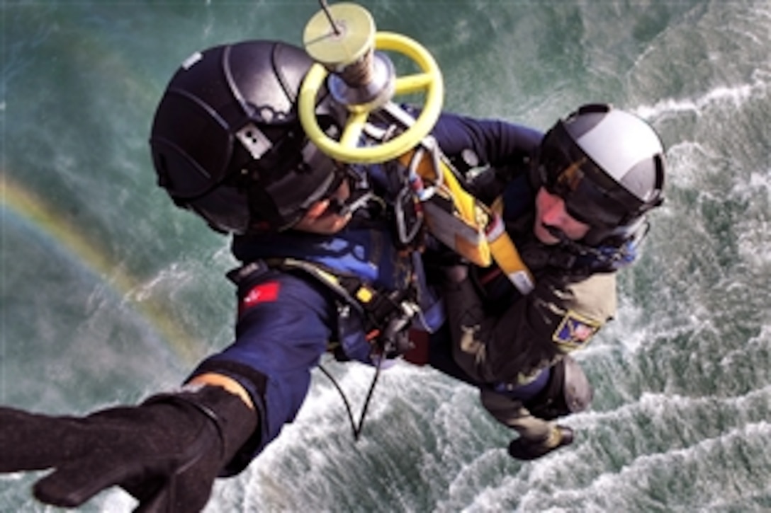 Hong Kong Government Flying Service Lt. Vincent Wong, left, and U.S. Air National Guard Tech. Sgt. Brandon Stuemke, below, practice seaborne hoisting during preparations for the Hong Kong Search and Rescue Exercise known as SAREX 2008 in Hong Kong, Oct. 22, 2008. Stuemke is assigned to the Alaska Air National Guard's 212th Rescue Squadro. SAREX 2008 is an annual exercise involving units from the U.S., Hong Kong and the People's Republic of China.