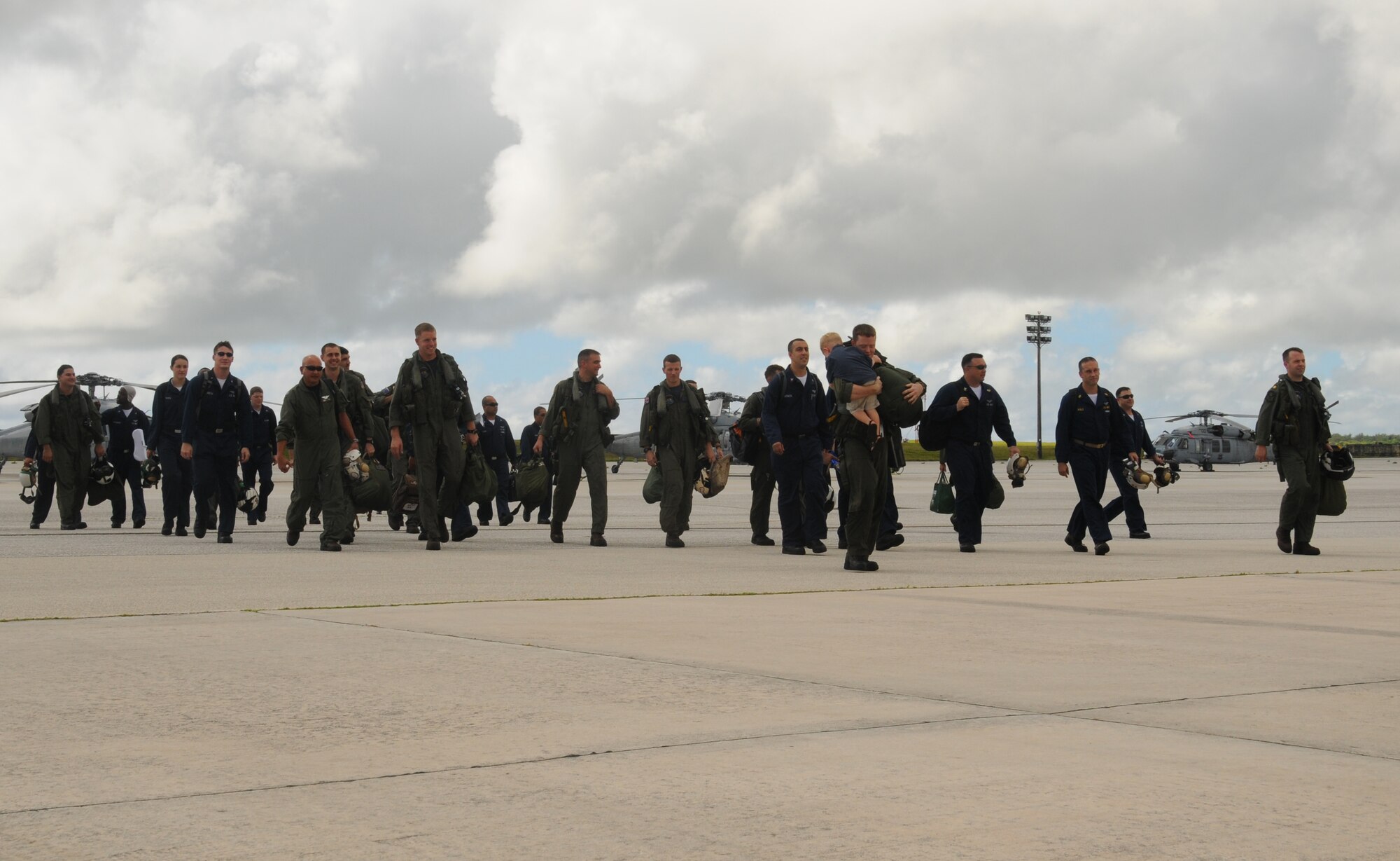 ANDERSEN AIR FORCE BASE, Guam - Sailors from Helicopter Sea Combat Twenty-Five Detachment 1, return home here Oct. 29 from a nine-month deployment to the Western Pacific.  The detachment deployed with two MH-60S Knighthawk helicopters, 25 enlisted Sailors and six naval officers.  (U.S. Air Force photo by Staff Sgt. Jamie Lessard)