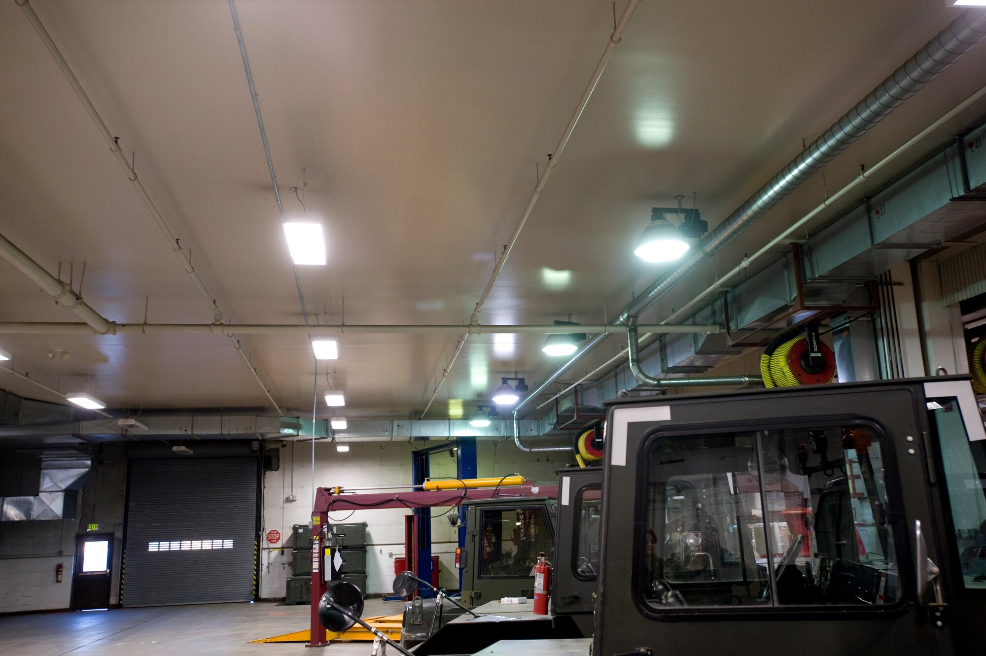ELMENDORF AIR FORCE BASE Alaska -- The 3rd Logistics Readiness Squadron's main building transitions to new lighting Oct. 27. The new vertical motion-sensor lights containing T8 bulbs will replace the old, round T12 lighting systems. (U.S. Air Force photo/Senior Airman Matthew Owens)