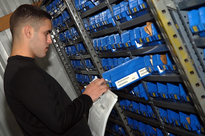 Airman 1st Class Joan Gomez stocks items in the aircraft parts store on base Oct. 29. Airmen on base organize and maintain more than 29,000 aircraft and vehicle line items worth more than a total of $140 million. Airman Gomez is an aircraft parts store clerk with the 437th Logistics Readiness Squadron. (U.S. Air Force photo/Airman 1st Class Melissa White)