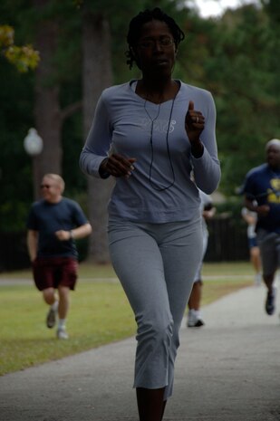 Staff Sgt. Monik Wells runs to the finish line during a Wingman Day activity on base Oct. 27. Squadrons and units on base participated in various Wingman Day events to bring members together and provide information to create a culture of responsible choices. Sergeant Wells is from the 437th Airlift Wing. (U.S. Air Force photo/Airman 1st Class Timothy Taylor)