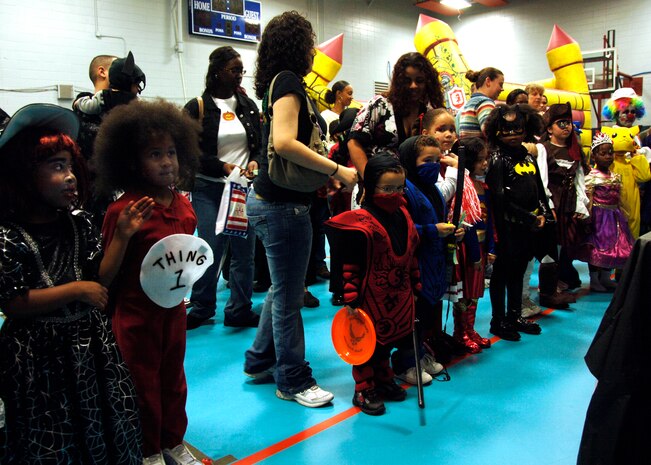 Children participate in the costume contest during the fall festival on base Oct. 24. The base Youth Programs sponsored the fall festival with games, prizes and a costume contest for military families. (U.S. Air Force photo/Airman 1st Class Timothy Taylor)