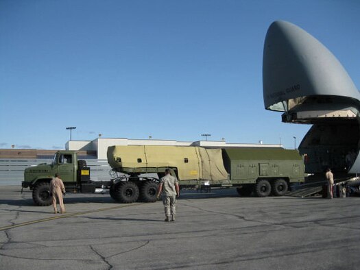 The 512th Airlift Control Flight downloads a section of a Russian radar unit at Eielson Air Force Base, Ala., Sept. 16 in support of Red Flag-Alaska. The nine-person team from Dover was tasked with the planning, uploading and downloading of three separate C-5 cargo loads. (U.S. Air Force photo)