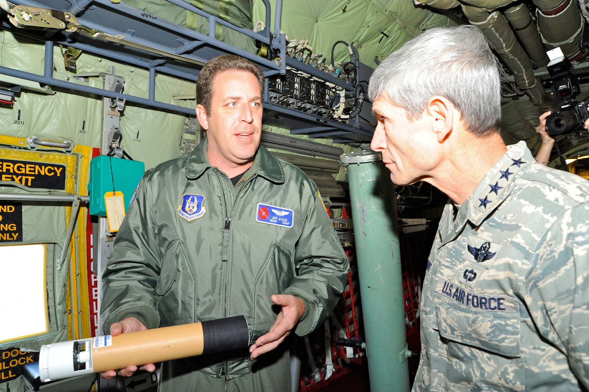 Master Sgt. Jeff Stack, a weather reconnaissance loadmaster, explains how the dropsonde he is holding collects weather information inside storms to Air Force Chief of Staff Gen. Norton A. Schwartz. The life-saving data collected by the Hurricane Hunters, Air Force reservists assigned to the 53rd Weather Reconnaissance Squadron, improves National Hurricane Center forecasts by 30 percent. The Air Force Reserve Command unit at Keesler Air Force Base, Miss., is the only Department of Defense unit to fly into hurricanes. General Schwartz visited Mississippi in late October to speak at the 30th annual Salute to the Military, an event honoring the Airmen and Citizen Airmen of the Gulf Coast region. (U.S. Air Force photo/Maj. Chad E. Gibson)