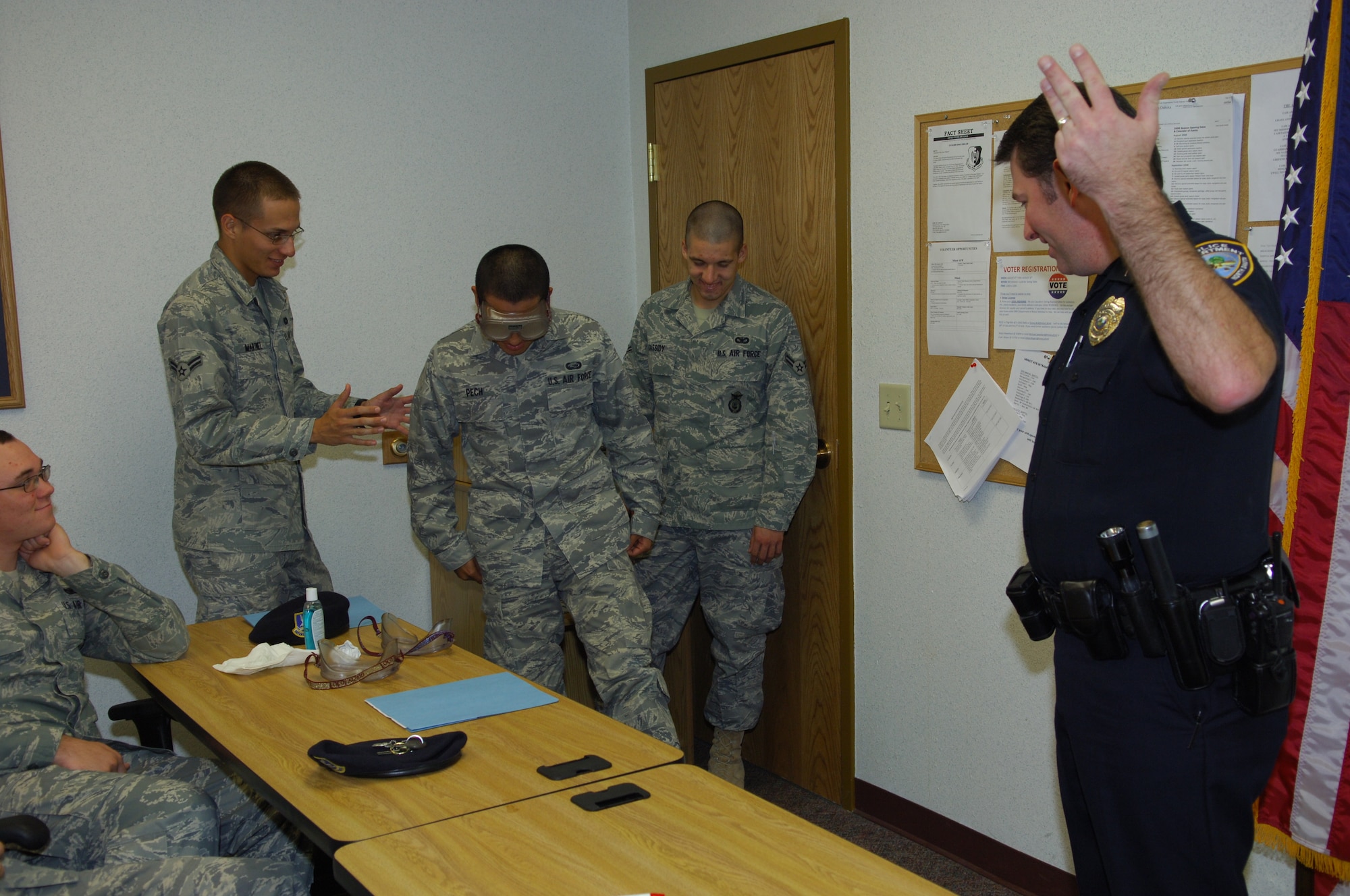 MINOT AIR FORCE BASE, N.D. – Airman Jesus Pech, 5th Force Support Squadron, tries to balance on one foot while wearing the “beer goggles” as part of Officer Richard Lewellyn’s briefing at the First Term Airmen Center here Oct. 17. Officer Lewellyn, a member of the Minot police department’s crime prevention unit, will be giving weekly briefings to FTAC classes about the consequences of driving under the influence. (U.S. Air Force photo by Senior Airman Cassandra Jones)