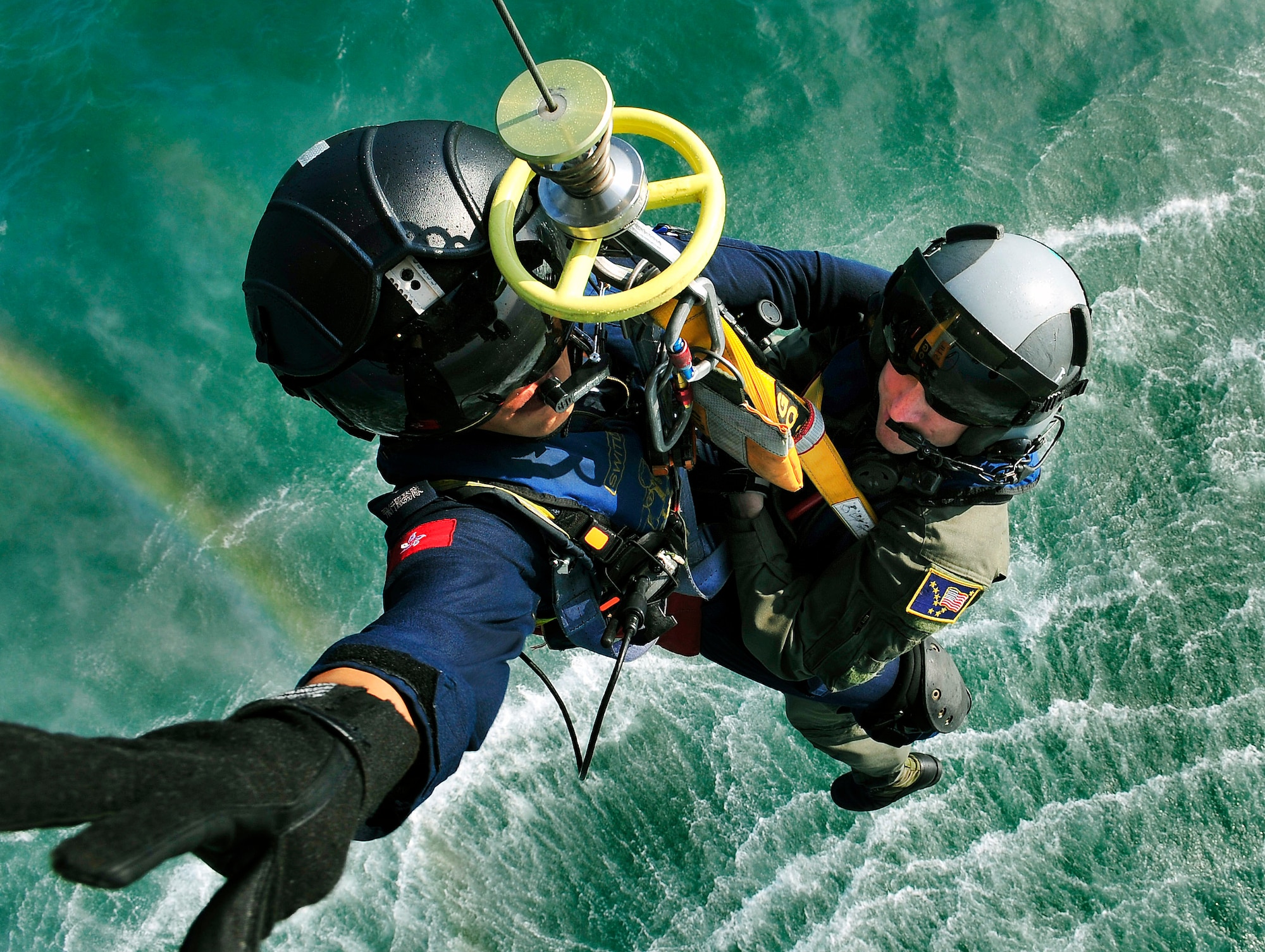 Hong Kong Government Flying Service Lt. Vincent Wong (left) and Tech. Sgt. Brandon Stuemke practice seaborne hoisting during preparations for Hong Kong Search and Rescue Exercise 2008 Oct. 22 off the coast of Hong Kong. Sergeant Stuemke is a member of the Alaska Air National Guard's 212th Rescue Squadron, based at Kulis Air National Guard Base in Anchorage, Alaska. The annual exercise involved units from the U.S., Hong Kong and the People's Republic of China. (U.S. Navy photo/Petty Officer 1st Class Michael B. Watkins) 
