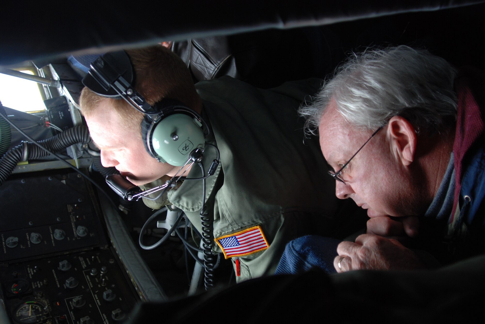 MCCONNELL AIR FORCE BASE, Kan. – Airman 1st Class Phillip Inmon, 384th Air Refueling Squadron boom operator shows honorary commander, Greg Aylaward, how he refuels a B-1 Lancer from a KC-135 Stratotanker, during an honorary commander orientation flight, Oct. 23. (Photo by Staff Sgt. Amanda Currier