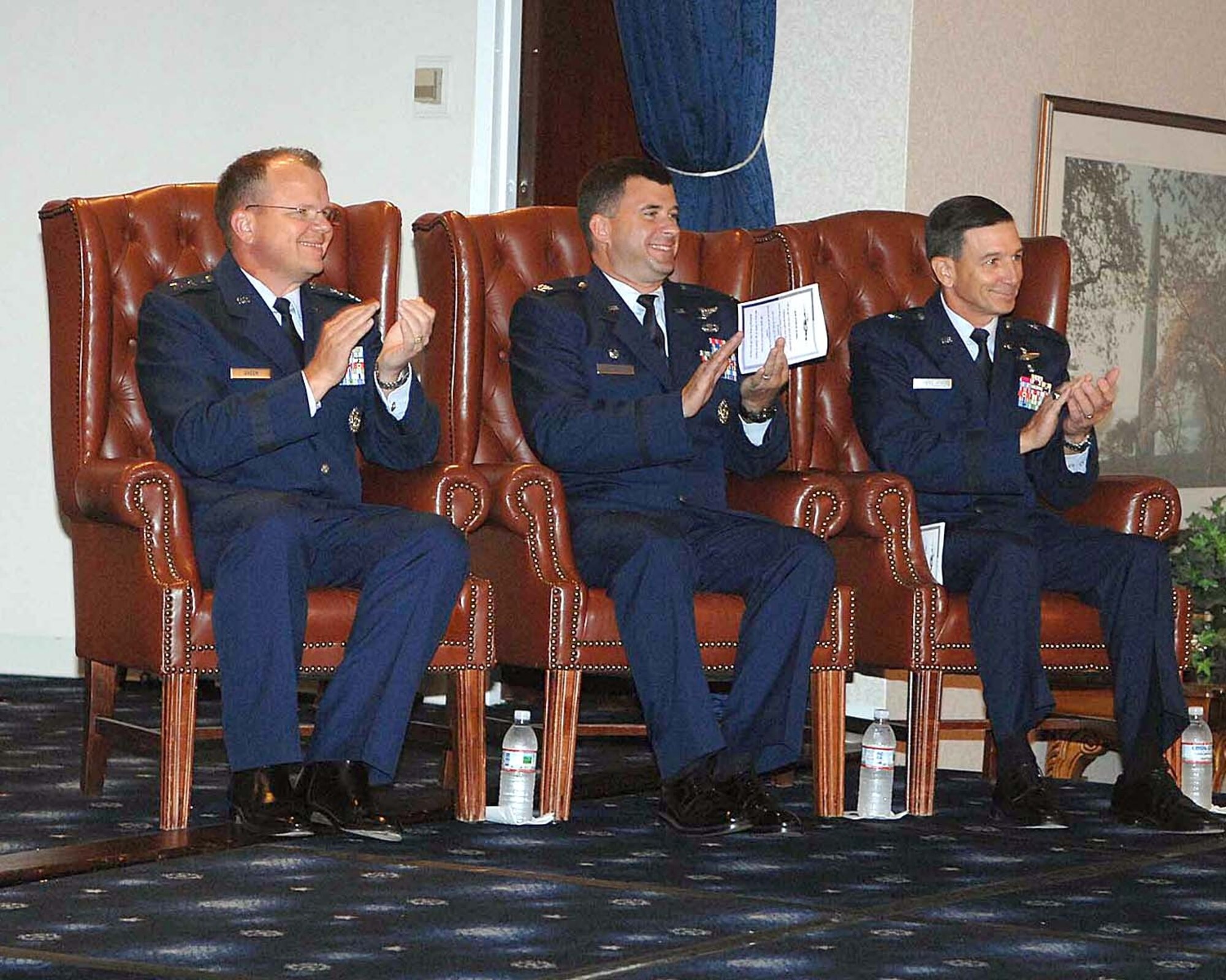 Maj. Gen. (Dr.) Bruce Green, Air Force deputy surgeon general, left, presided over the Sept. 5 change of command ceremony in which Brig. Gen. (Dr.) Byron Hepburn, right, assumed command of the Air Force Medical Support Agency from Col. (Dr.) Brian Masterson, center.  (U.S. Air Force photo)