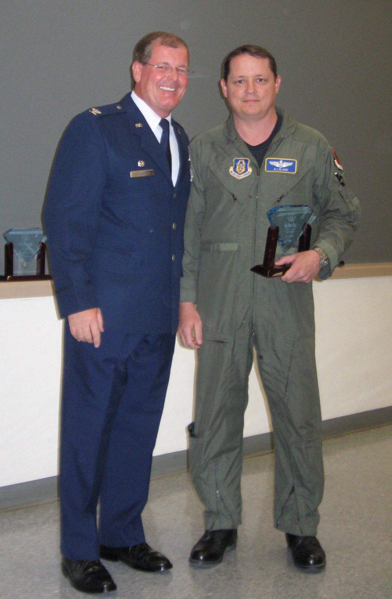 Maj. Blood, 78th Reconnaissance Squadron, receives his award as Field Grade Officer of the Half during Commander's Call on Oct. 25.