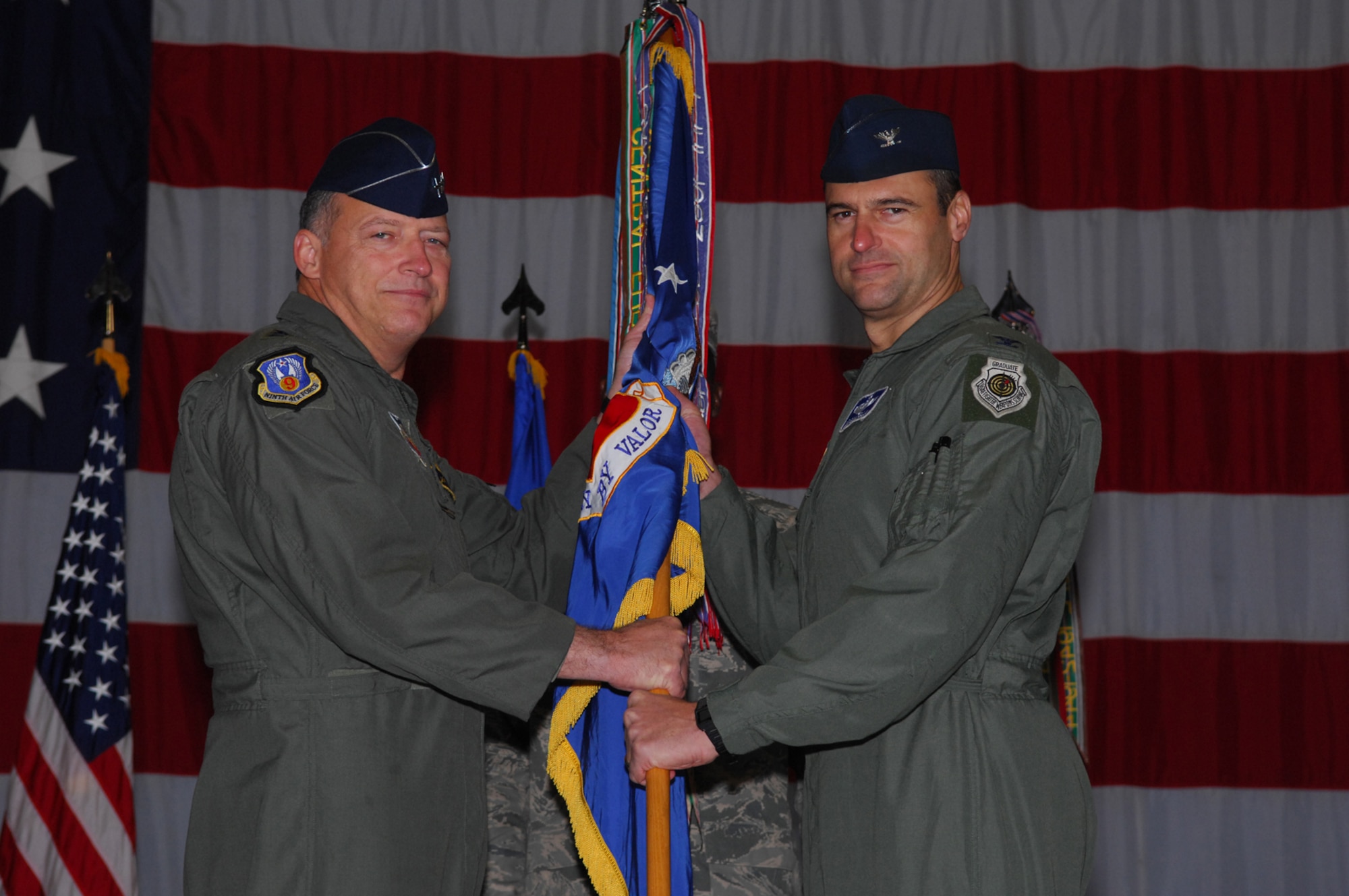 SHAW AIR FORCE BASE -- Colonel Joseph T. Guastella, 20th Fighter Wing commander, receives command of the 20th FW from Lieutenant General Gary North, 9th Air Force commander, during a Change of Command cermony on October 29, 2008. Colonel Guastella assumed command of the 20th FW replacing Colonel James Post. (U.S. Air Force photo/ Senior Airman Matthew Davis)