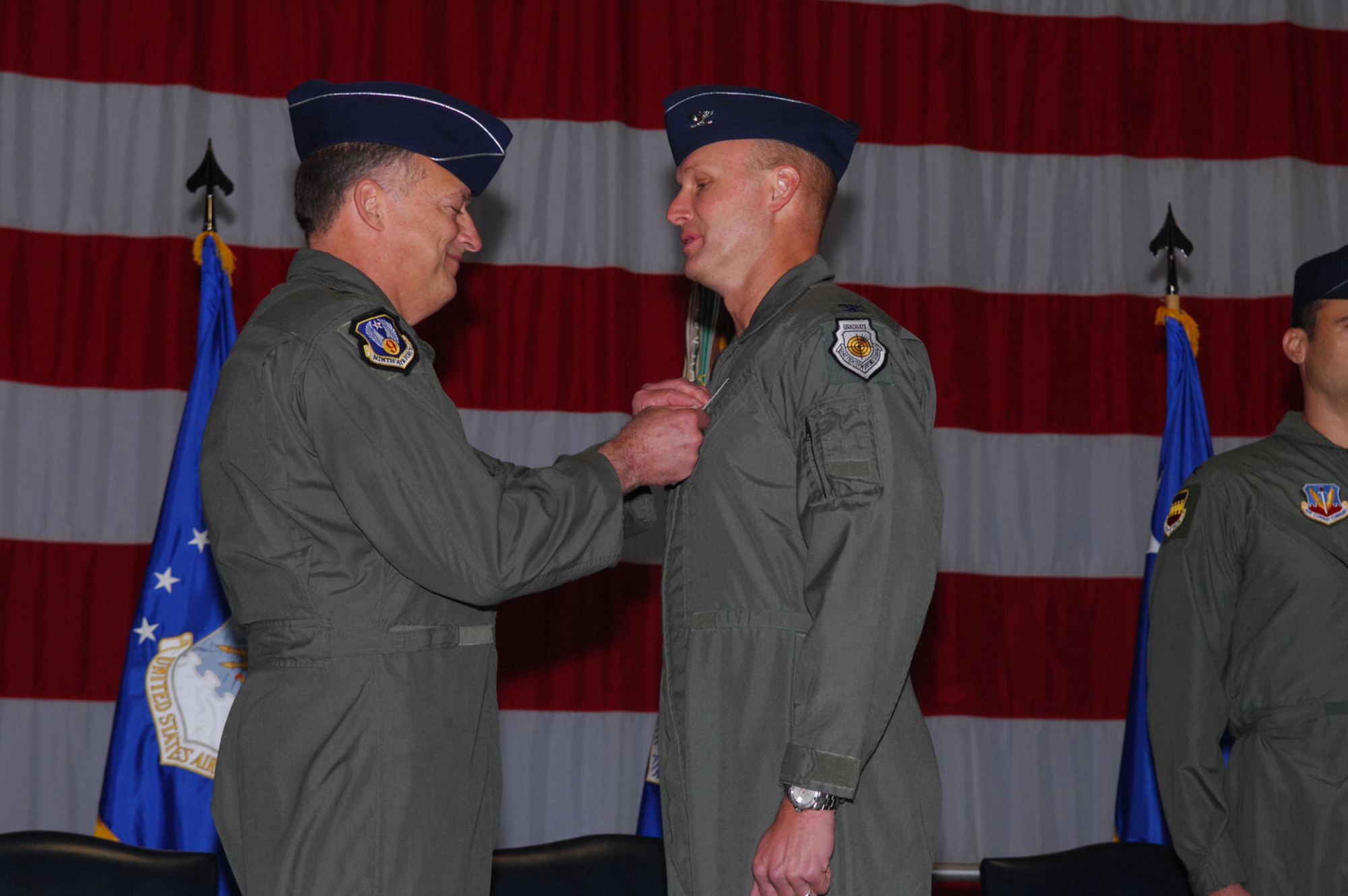 SHAW AIR FORCE BASE -- Colonel James Post, former 20th Fighter Wing commander, receives the Legion of Merit medal from Lieutenant General Gary North, 9th Air Force commander, during a Change of Command cermony on October 29, 2008. Colonel Joseph Guastella assumed command of the 20th FW replacing Colonel Post. (U.S. Air Force photo/ Senior Airman Matthew Davis)