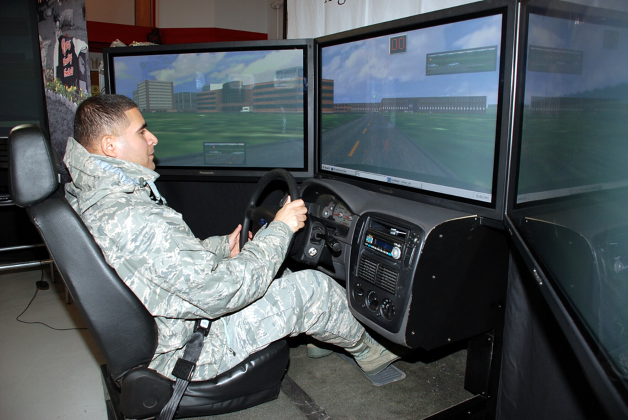 Tech. Sgt. Johann Ochoa, 305th Medical Group ADAPT NCO in charge, tries the drinking and driving simulator during the Save A Life tour visit Oct. 29 at the Airmen’s Firehouse. The Save A Life tour travels around the country -- to high schools, colleges and military installations -- to spread the word about the realities of drinking and driving. The drinking and driving simulator gives participants a completely realistic, sober perspective of the effects of driving while intoxicated. (U.S. Air Force photo/Airman 1st Class Bekah Phy)