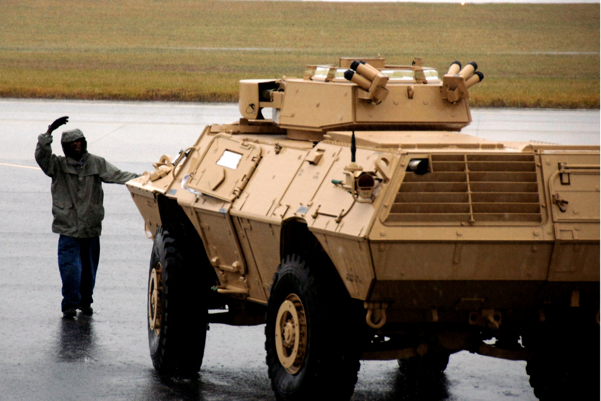 Corrie Frazier guides an armored security vehicle toward the back of a C-17 Globemaster III Oct. 24 at Charleston Air Force Base, S.C. The ASV is a four-wheel-drive vehicle that provides ballistic protection to warfighters who are using them against various threats. Mr. Frazier is with the 437th Aerial Port Squadron. (U.S. Air Force photo/Airman 1st Class Timothy Taylor)